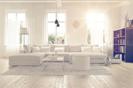 Clean living room with white furniture 