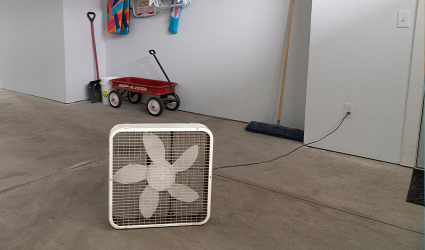 Box fan in middle of garage