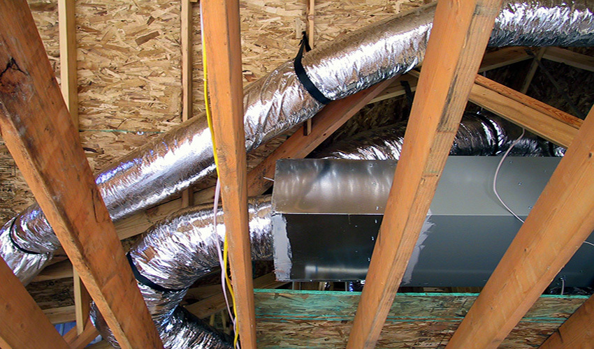 Wrapped air ducts in rafters.