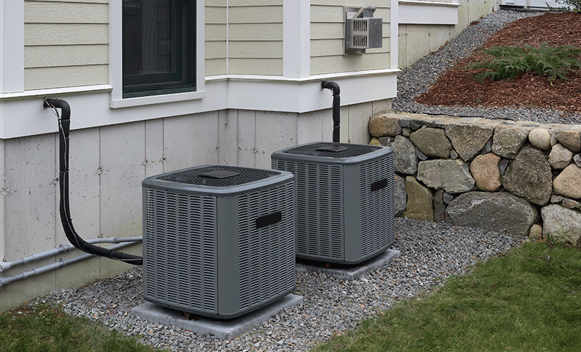 Two air conditioners outside of home