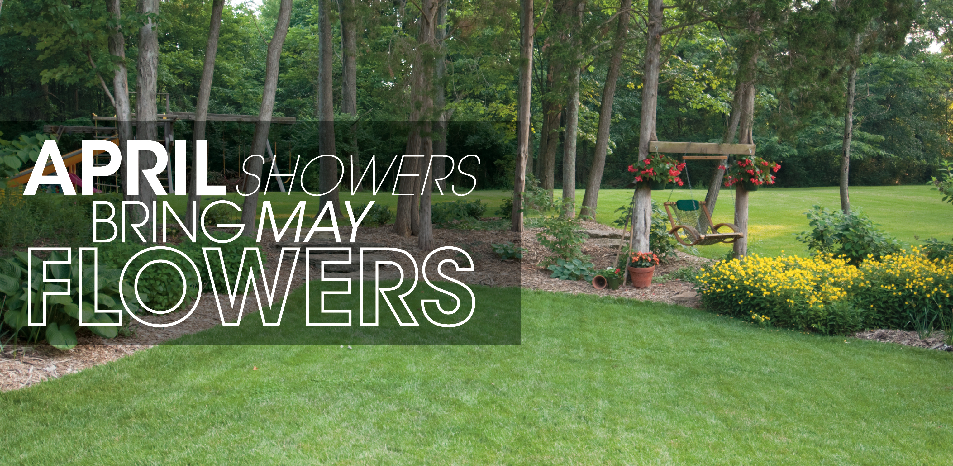 Lawn and trees with text: "April showers bring May flowers"