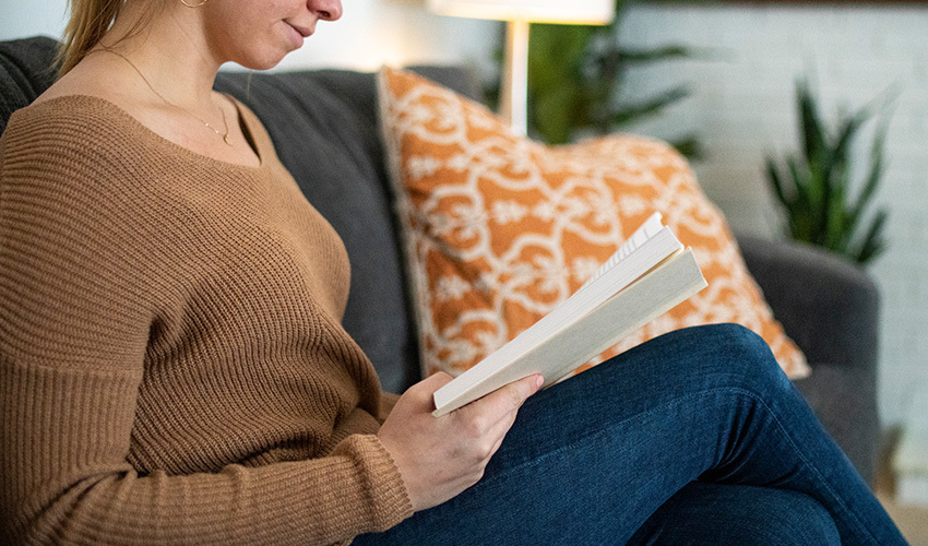 Woman reading on a couch